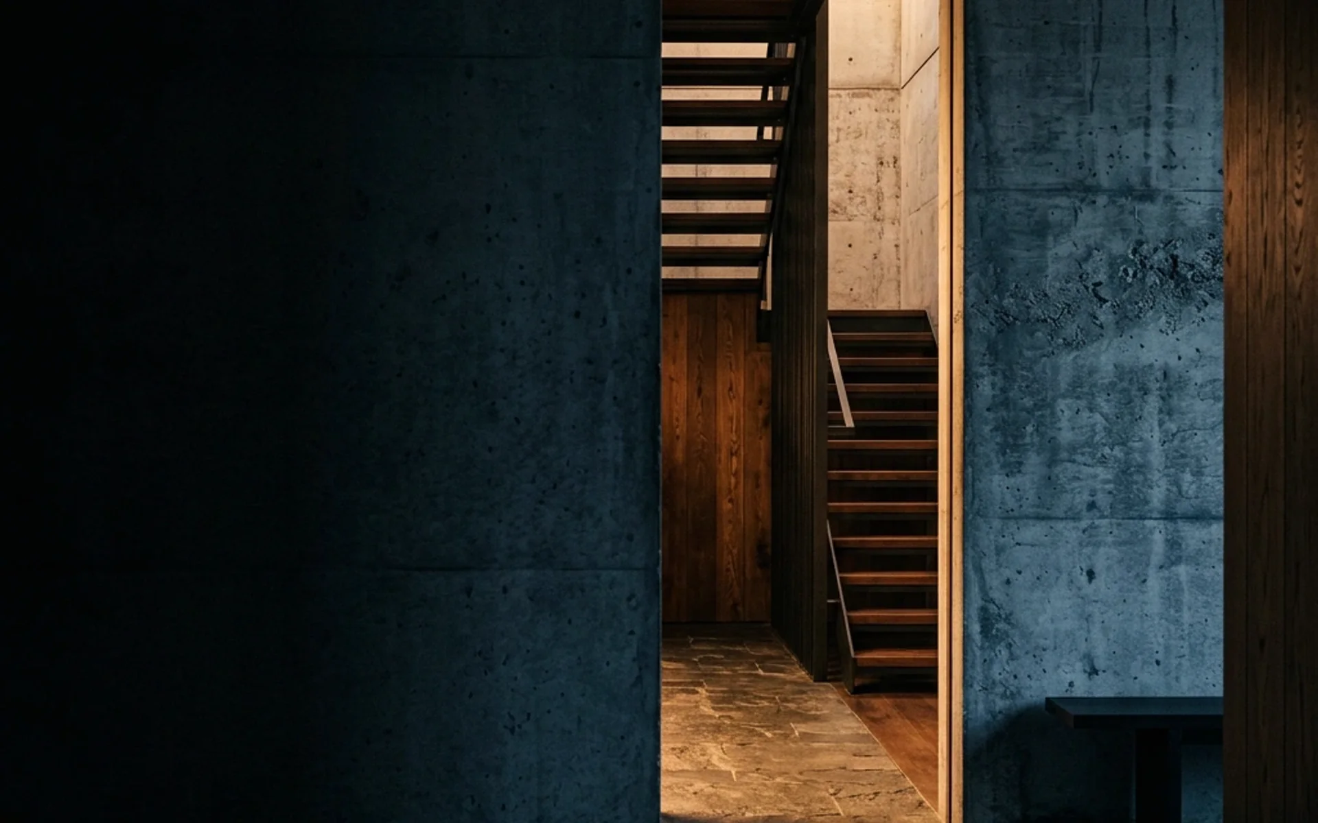 Umbral iluminado dentro de una arquitectura de concreto y madera